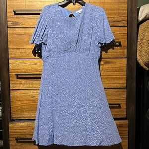 White polka dot open back mini dress
